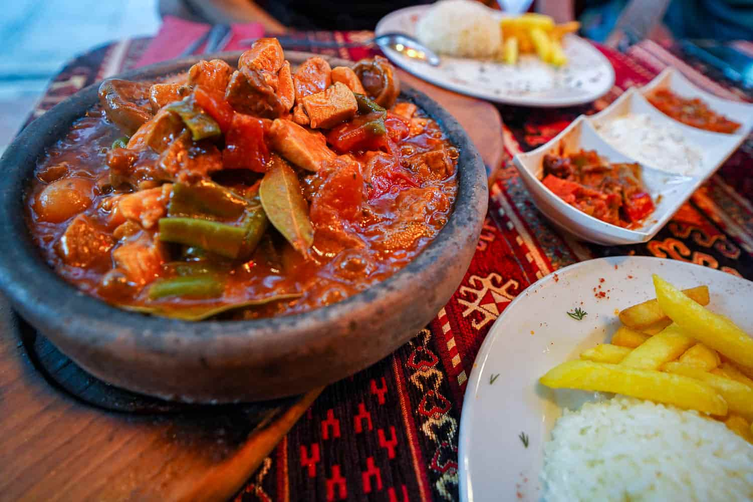 Pottery testi kebab in clay bowl on table