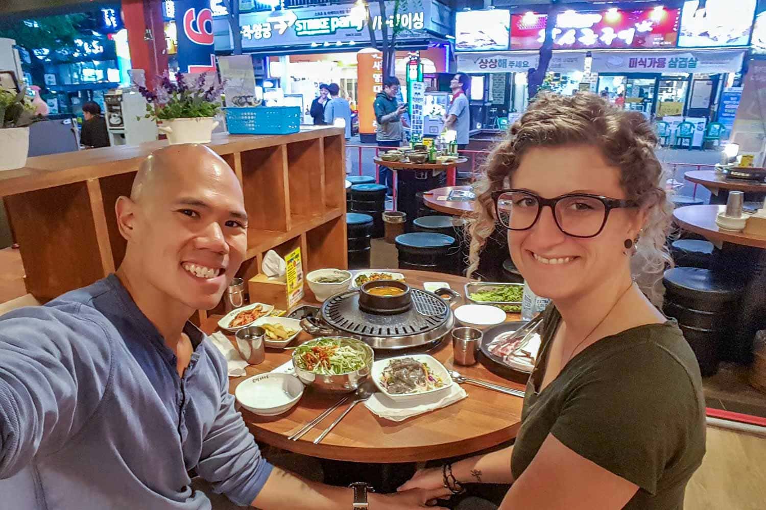 Chris and Steph of Hungry Two Travel eating Korean BBQ