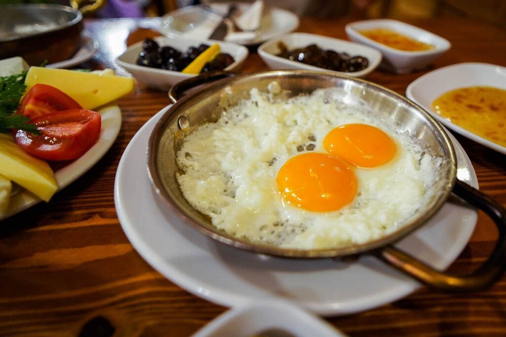 Fried eggs in a metal bowl