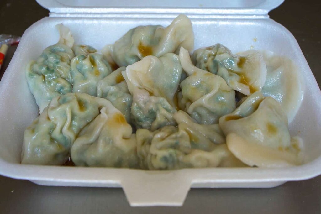 Box of Dong Bei Dumplings with soy sauce