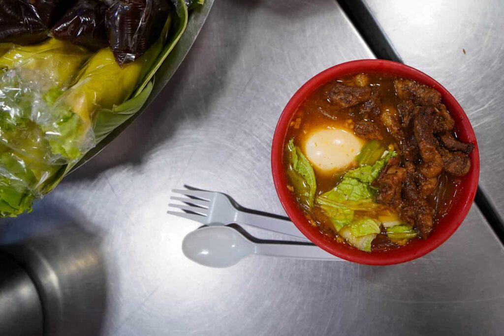 Aerial view of bowl of best street food sotanghon glass noodles with pork