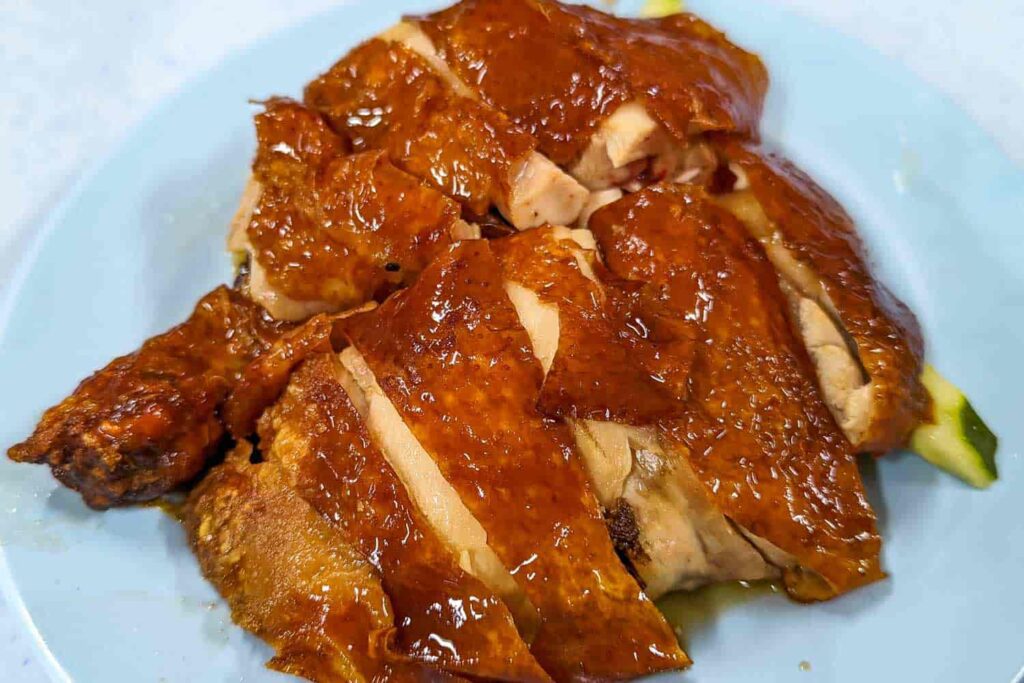 Golden orange roasted chicken on plate