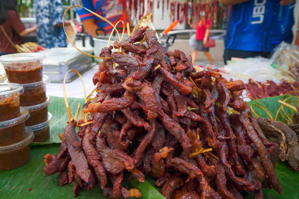 Large pile of moo dad deaw thai street food jerky