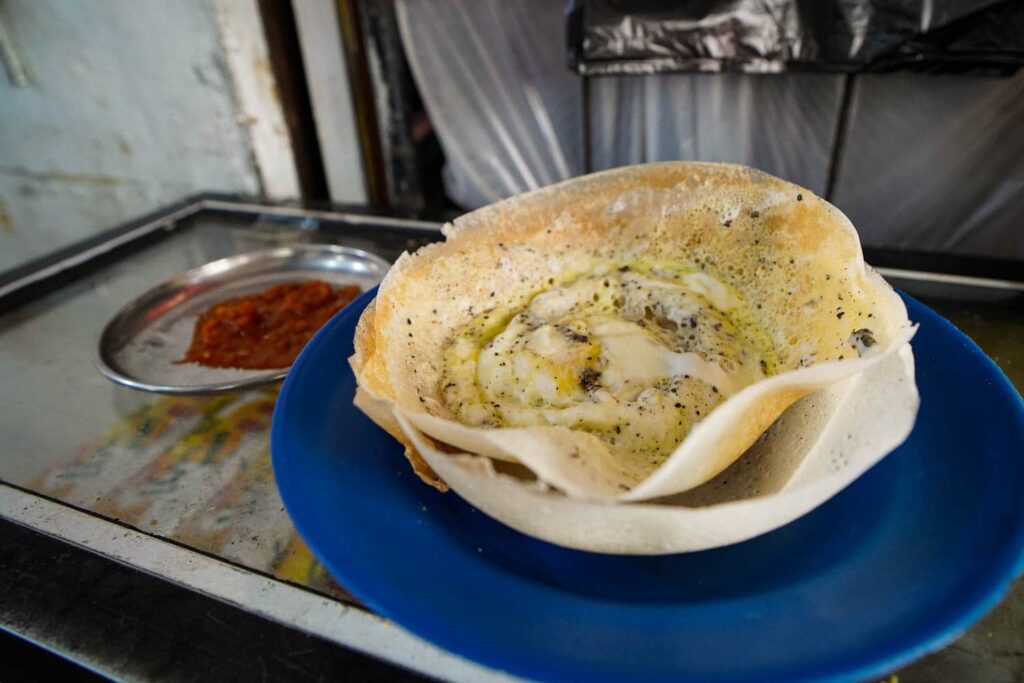 two egg hoppers with spicy sombol on glass table