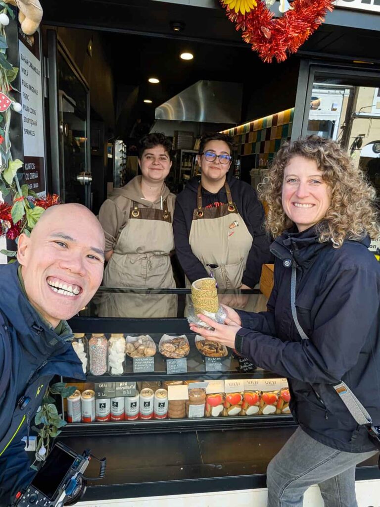 Hungry Two Travel smiling taking selfie with two women selling kurtoskalacs in Romania